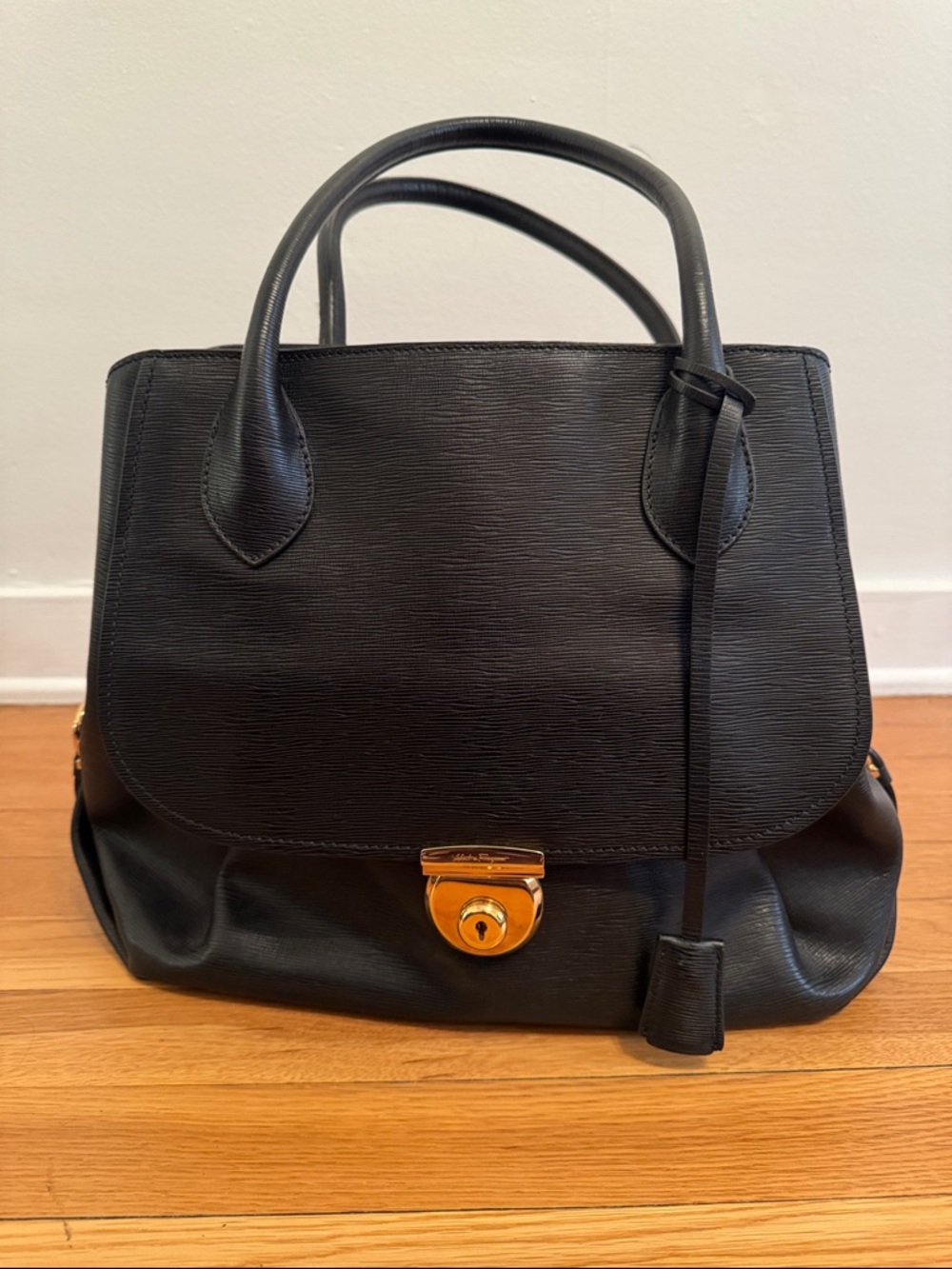 Salvatore Ferragamo Black Leather Top-Handle Satchel with Gold Hardware.